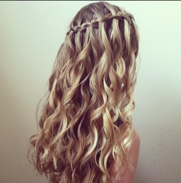 Wow, this is pretty. This is a waterfall braid with curly hair. I have naturally straight hair so if I want to do this I'll have to curl my hair... Oh well it'll be worth it!