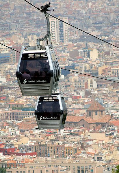 Barcelona's Montjuic Cable Cars carry you up the mountain, providing unparalleled views of the city during the journey and when you reach your destination. A magnificent vantage point.