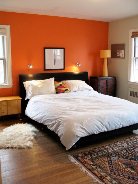 bright orange wall. Love the black and orange