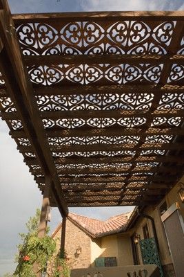 Great idea for instant shade in your garden. Cut out metal panels.
