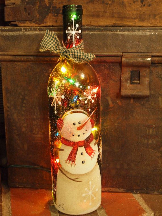 Wine bottle handpainted with snowman...colored lights.