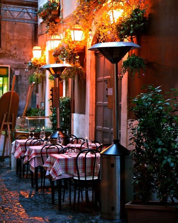 Sidewalk Dining in Rome, Italy. America should have more of these quaint little outdoor cafe places.