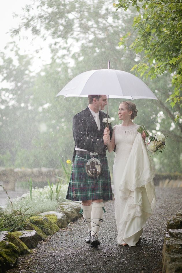 This bride and groom didn't let rain dampen their spirits! Charming rustic barn wedding in Ireland.