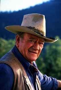 y Dad used to make us put our hand over our heart whenever John Wayne would appear on the screen.