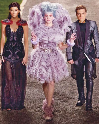 Catching Fire .... This will certainly please fans of the series, but while I enjoyed it well enough I thought it shared some flaws with the book. Every single character seems more politically aware than Katniss.
