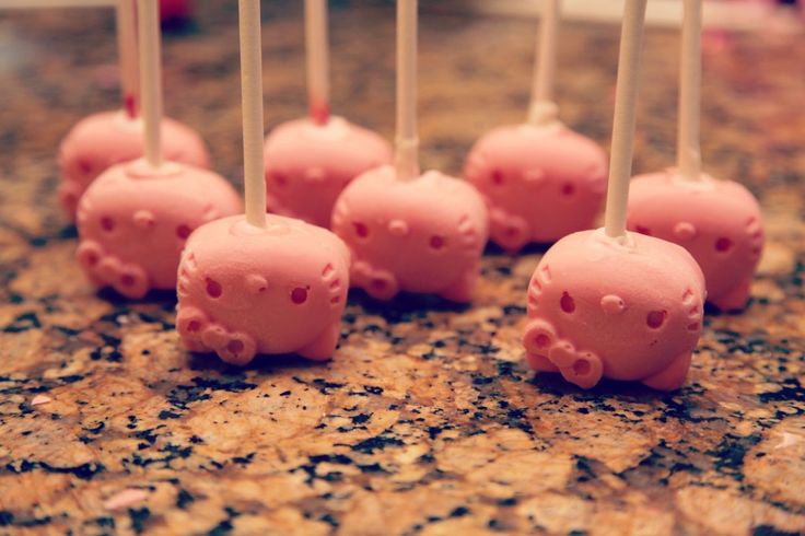 diy hello kitty chocolate pops   1. use hello kitty ice cube tray as mold  2. melt chocolate (I used ghiradelli white chocolate with red food coloring)  3. pop choclate cubes out  4. Heat the end of a stick with boiling water. Poke a hole in the head.   5
