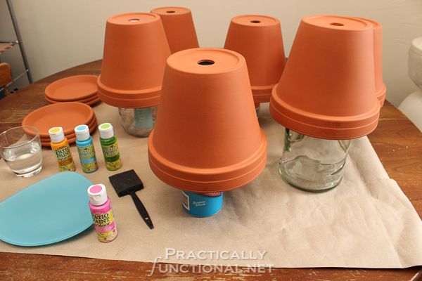 How To Seal Painted Flower Pots - Turn pots upside down on stands to paint all surfaces at once