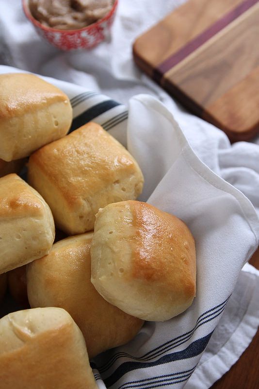 Fluffy and buttery homemade Texas Roadhouse Rolls with Cinnamon Honey Butter. No more waiting in long lines. Now you can make them at home.