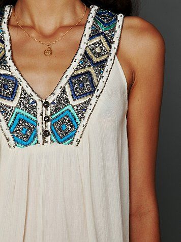 Sleeveless embroidered top.