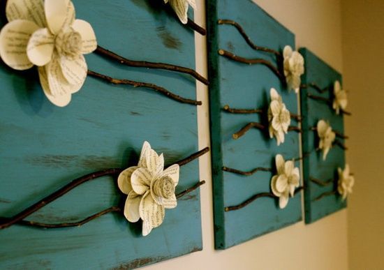 Canvas, paper flowers, and sticks. I think this would be awesome to try.