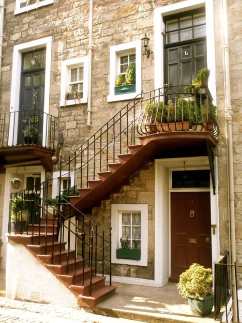 I like the little window under the stairs. The railings are very nice with the look of the building as well.