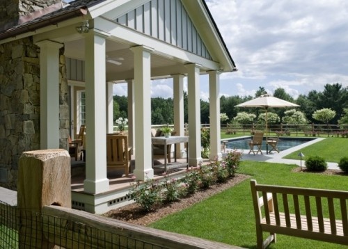 like this... moderate hardscape around pool... split rail fence with wire mesh?