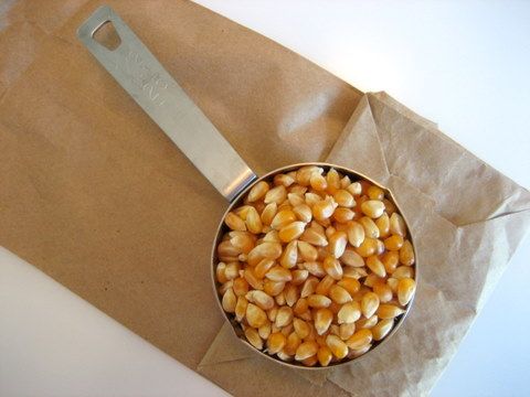 i normally cook on the stove top but i saw this... brown paper bag + kernel + microwave. =) tons cheaper than pre made microwavable ones.