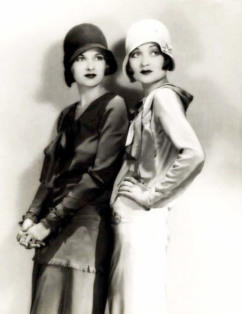 Cloche hat: A woman's close-fitting hat with a deep, bell-shaped crown and often a narrow, turned-down brim worn in the 20s.