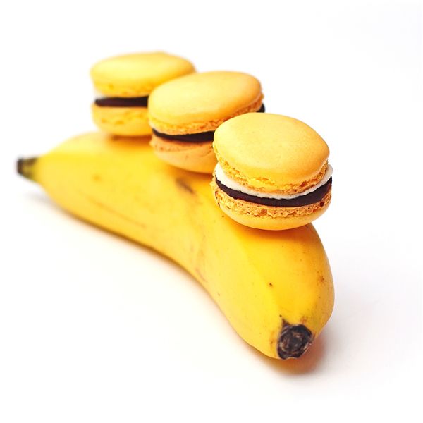 “ 'Banana' macarons filled with banana buttercream and chocolate ganache. A play on the banana split, if you like…" [I like!]