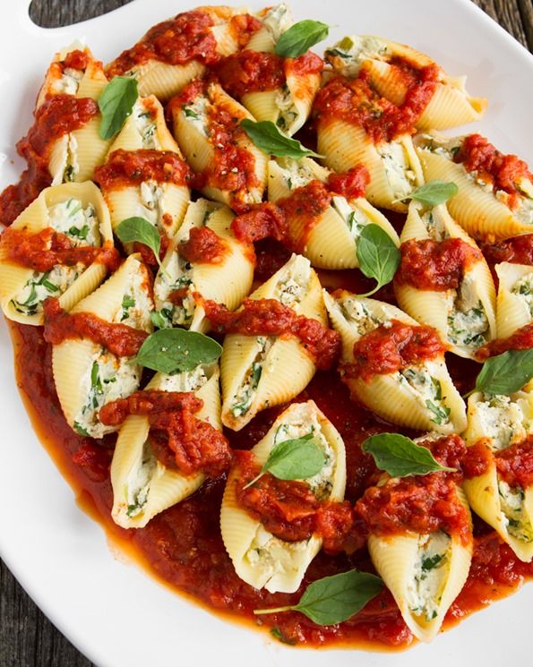 Jumbo Pasta Shells stuffed with a savory tofu "ricotta" and herb filling. Topped with pasta sauce and baked...yummy!