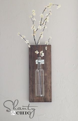 DIY wall-mounted wine bottle vase. I go through plenty of wine bottles needing to be upcycled!
