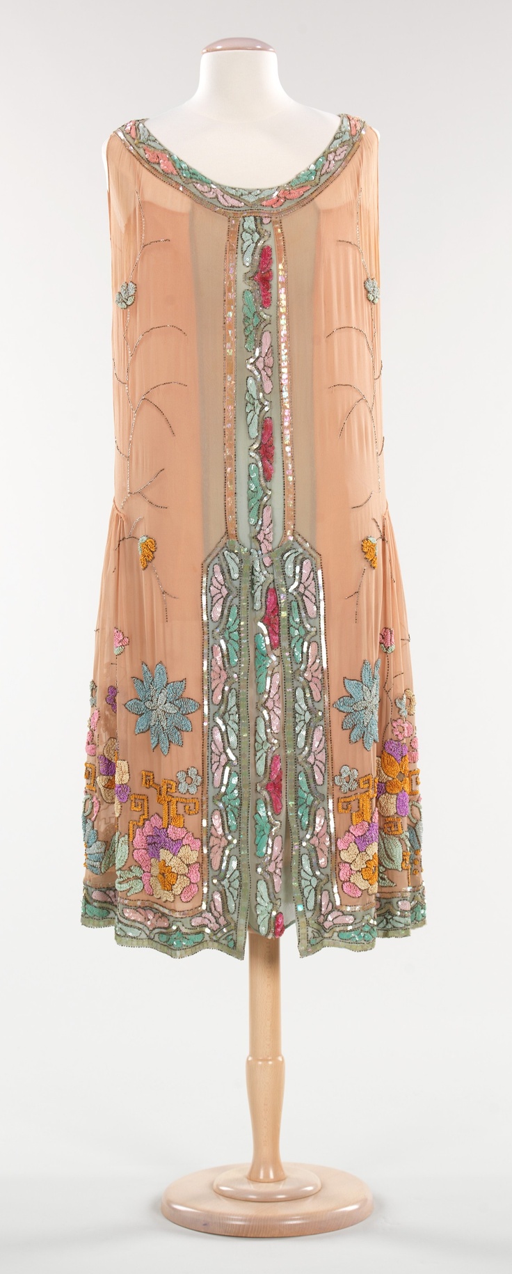 Evening Dress: 1925, French, silk, plastic. "The 1920s marked the era of the flapper, who was known for her late nights on the town filled with dancing such dances as the Charleston and the Black Bottom. To accommodate this new lifestyle the fashions