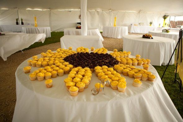 sunflower cupcake centerpiece - this would be so much easier than decorating each cupcake as a sunflower