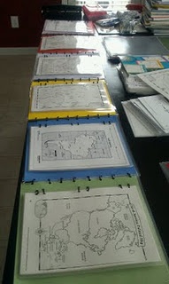 Reusable homemade geography book. Maps and info pages for each continent are attached together.  Pockets contain reports and work from each child.  Added to yearly, so its an accumulation of work.