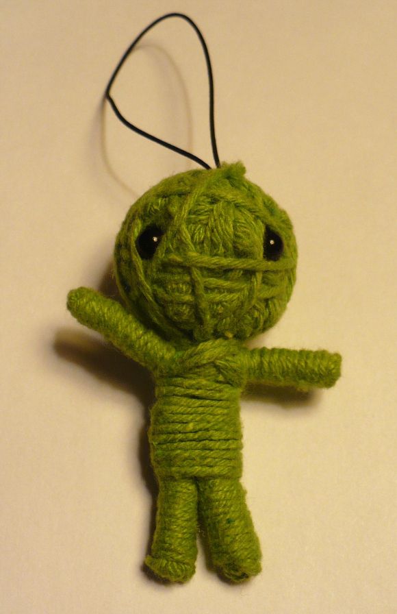 Cheap dollar craft small voodoo-doll (like the kind found in gumbull/junk machines in restaurants and stores.