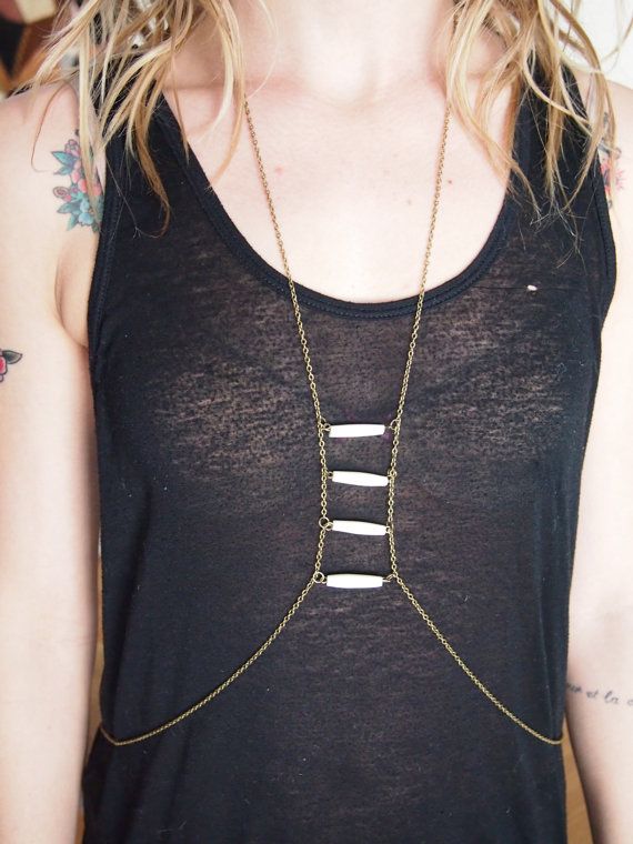 As a necklace with cow bone bone tubes
