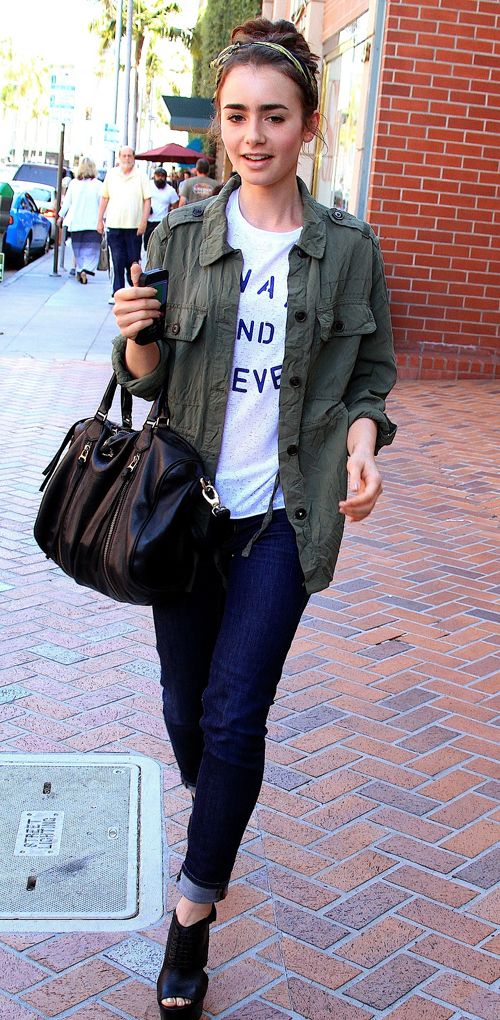 Green jacket over casual jeans and statement t-shirt + black accessories