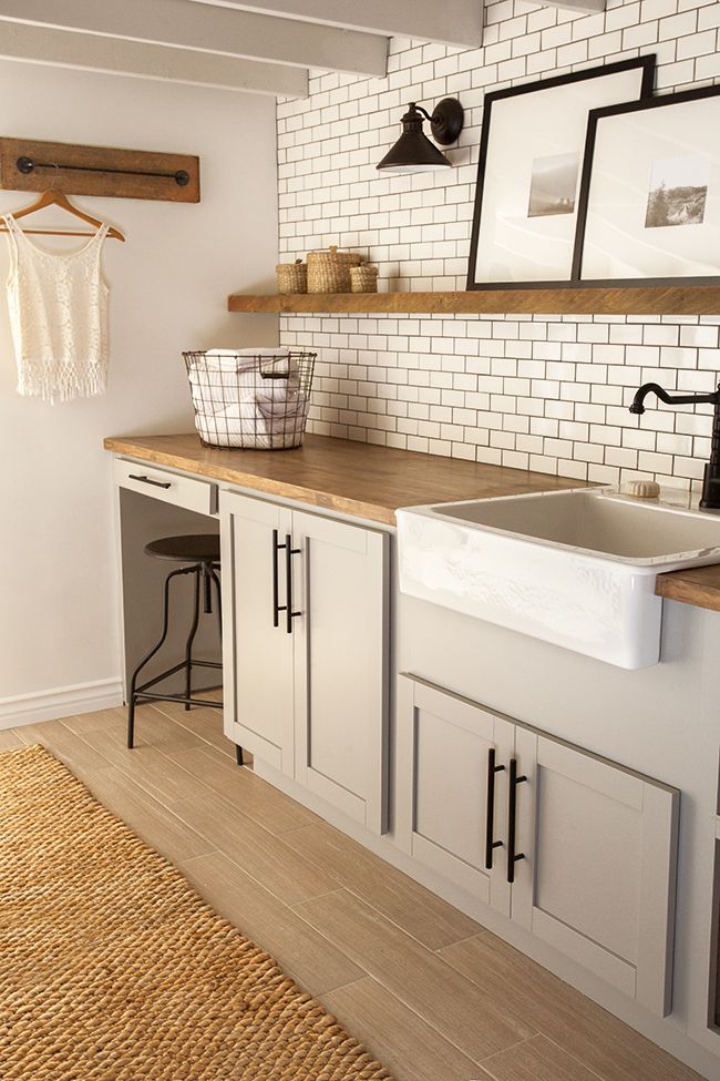 Towel rod for hanging hangers ... maybe instead of hooks???Install them on thick flat molding at top of bead board ... hmm ... New Laundry Room: The Reveal!