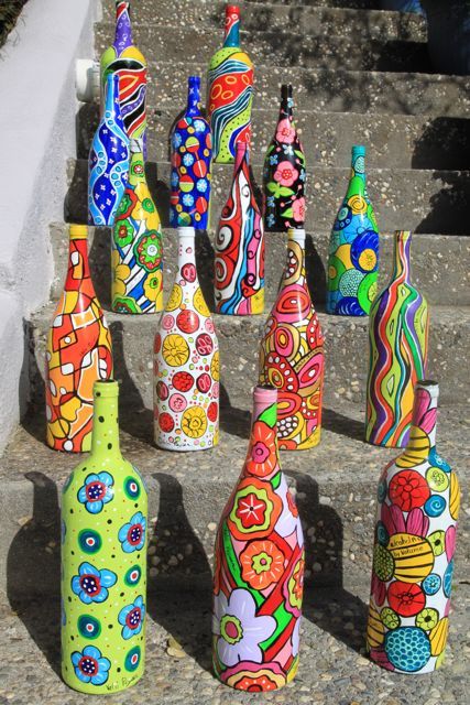 decorated wine bottles; use mod pog and tissue paper to decorate bottles. Could work as decorations for living room or kitchen.
