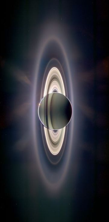 Saturn eclipsing the sun, with the Earth visible in the upper left section of Saturn's rings. In 2009, NASA's robotic Cassini spacecraft drifted in Saturn's shadow for about 12 hours and Cassini saw a view unlike any other. The rings light up 