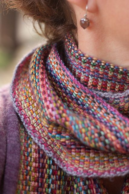 issoni-esque scarf. Looks like linen stitch using multiple colors of variegated yarns - one color per row. Knit lengthwise. Liked that the knitter knit into the back of the loop of the first and last stitches to tighten them-Ready to start this project!