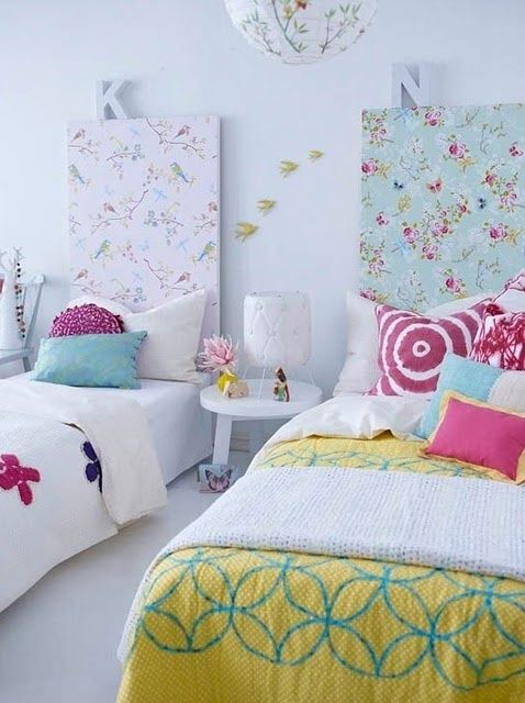 i know this is a little kid's room but I like the idea of taking a canvas covered in a printed fabric and using it as a head board