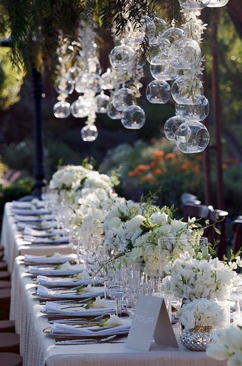 Love banquet styled tables with a small gap between tables for guests to move in between ....