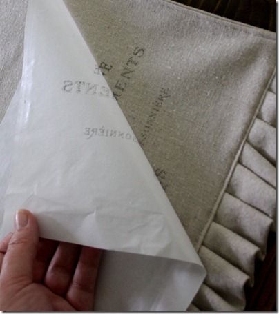 Print on wax paper and iron onto fabric