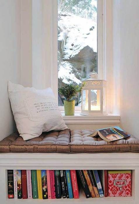 Window seat, full bookshelf, soft pillow, Moroccan lantern, and a touch of green. Perfect.