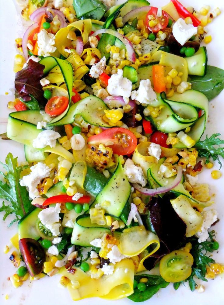 Summer salad with fresh vegetables, goat cheese and a light vinaigrette