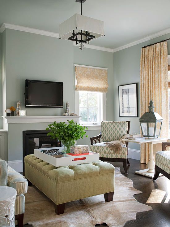 Comfy, Yet Chic:: The small living room at the front of the house functions as a grown-up space for entertaining. The colors here mimic those used in the rest of the house. An extra-large ottoman provides feet-up relaxation and also serves as a coffee tab