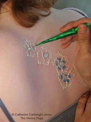 make your own gliding paste like henna but washes off and can be any colour and is easy to make