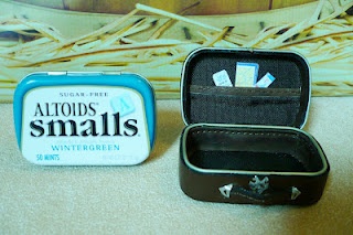 A Small Hearts Desire: leather suitcase made from an Altoids tin and an old wallet.