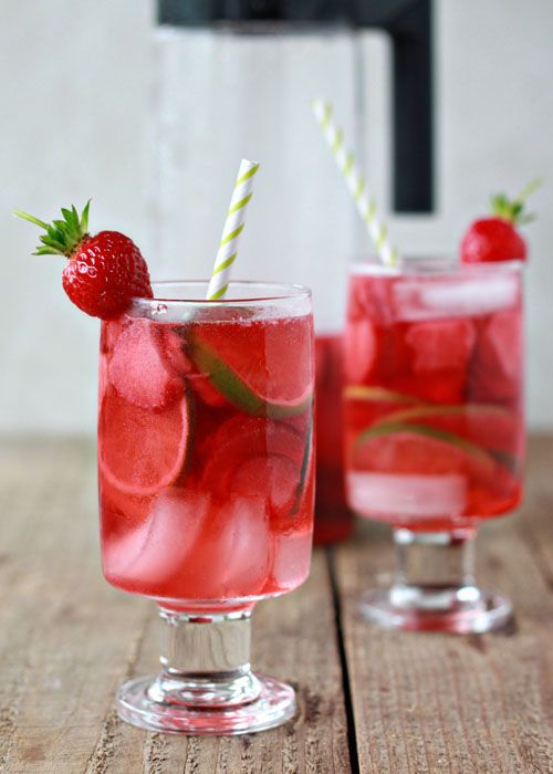 Strawberry Lime Rosé Sangria ~ This light, refreshing, and simple sangria is perfect for sipping on a toasty summer afternoon. The bright ruby-red hue is compliments of starting with a nice pink rose wine, and then soaking strawberries in it. Lime adds a 