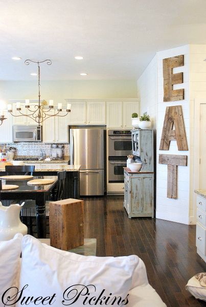 I like the mix between old & new here. Cupboard, light, wood, letters. I can even see adding some girly features (ie. Sparkly backsplash, fresh flowers) and a chunky farmhouse table.