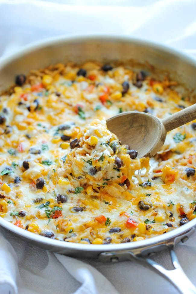 Cheesy Enchilada Rice Skillet - The easiest enchilada you will ever make. No rolling, no folding. Just throw everything into a skillet and you're set!