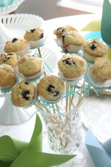 Bake Blueberry mini muffins using two paper liners for each. Using the same paper punched scalloped circles as those for the streamers, I threaded a circle and muffin onto a wooden skewer. I added ribbon bows to each and displayed the bouquet in a flower 