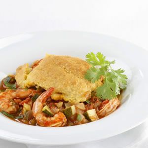 Here we make a low-fat shrimp and vegetable chili (which is quite tasty on its own) and top it with a layer of golden cornbread for a delicious casserole that can be made ahead. The dish serves 12, s...see more